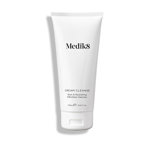 The 175 ml white tube of Medik8 Cream Cleanse™, enriched with shea butter, is a rich and nourishing cleanser ideal for moisturizing dry or sensitive skin.