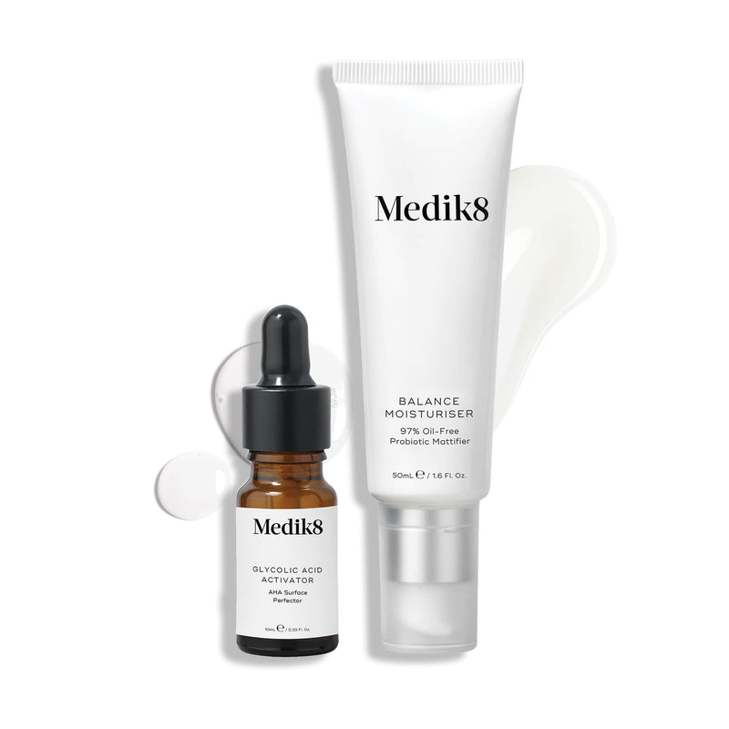 The Medik8 Balance Moisturiser™ & Glycolic Acid Activator™ set, featuring a dropper bottle and tube, acts as an AHA Surface Perfector against a pristine white background.