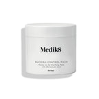 Medik8 Blemish Control Pads™ in a white container holds 60 clarifying pads with 2% salicylic acid to prevent breakouts effectively.