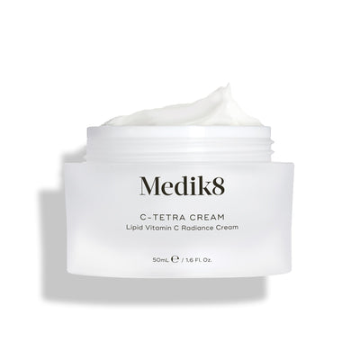 Medik8's C-Tetra® Cream, labeled Lipid Vitamin C Radiance Cream (50ml / 1.6 fl. oz.), features a white cream enriched with vitamin C and hyaluronic acid to nourish and hydrate skin for a radiant glow.