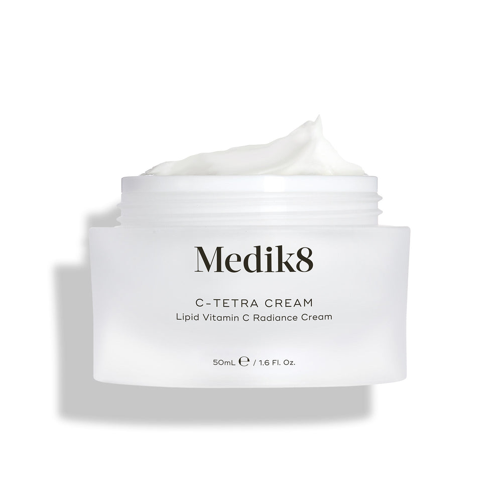 Medik8's C-Tetra® Cream, labeled Lipid Vitamin C Radiance Cream (50ml / 1.6 fl. oz.), features a white cream enriched with vitamin C and hyaluronic acid to nourish and hydrate skin for a radiant glow.