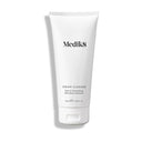 The 175 ml white tube of Medik8 Cream Cleanse™, enriched with shea butter, is a rich and nourishing cleanser ideal for moisturizing dry or sensitive skin.