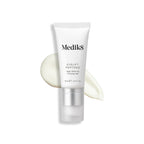 A tube of Medik8's Eyelift™ Peptides, 15ml, rests elegantly on a creamy white smear.