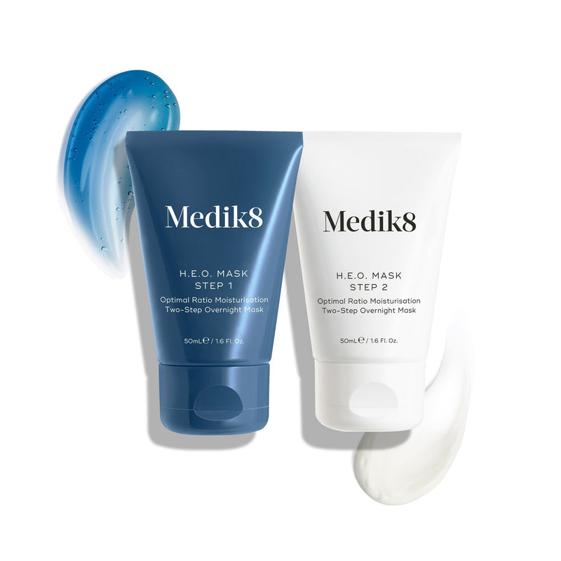 Two tubes of Medik8's H.E.O.® Mask are shown with blue and white cream swatches, offering deep hydration for irresistibly plump skin overnight.