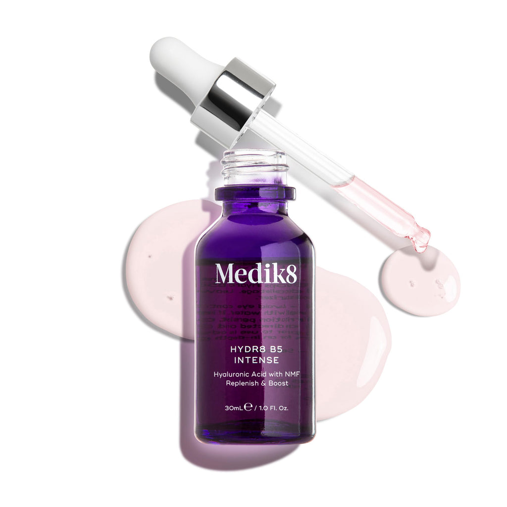 A purple bottle of Medik8's Hydr8 B5™ Intense serum, featuring a pipette and drops against a white background, delivers superfood antioxidants for ultimate skin rehydration.