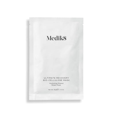 The Medik8 Ultimate Recovery™ Bio-Cellulose Mask, perfect for sensitive skin, provides intense hydration and soothing benefits. This 30g (1 oz) hydrating mineral sheet mask features sleek white packaging with bold black text.