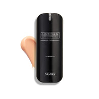 A sleek black bottle of Medik8 r-Retinoate® Intense, enriched with Vitamin A for potent wrinkle reduction, rests beside a luxurious cream smear on a pristine white background.