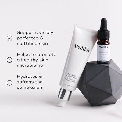 A Medik8 dropper bottle and a Balance Moisturiser™ tube sit beside a geometric object on a light background, highlighting benefits: mattified skin, healthy microbiome, and complexion hydration for an enhanced glow.
