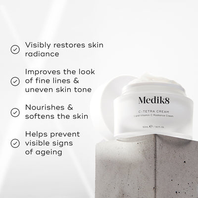 The Medik8 C-Tetra® Cream rests on concrete, showcasing its promise to restore skin radiance and improve fine lines. Enriched with vitamin C, it nourishes skin while combating signs of aging.
