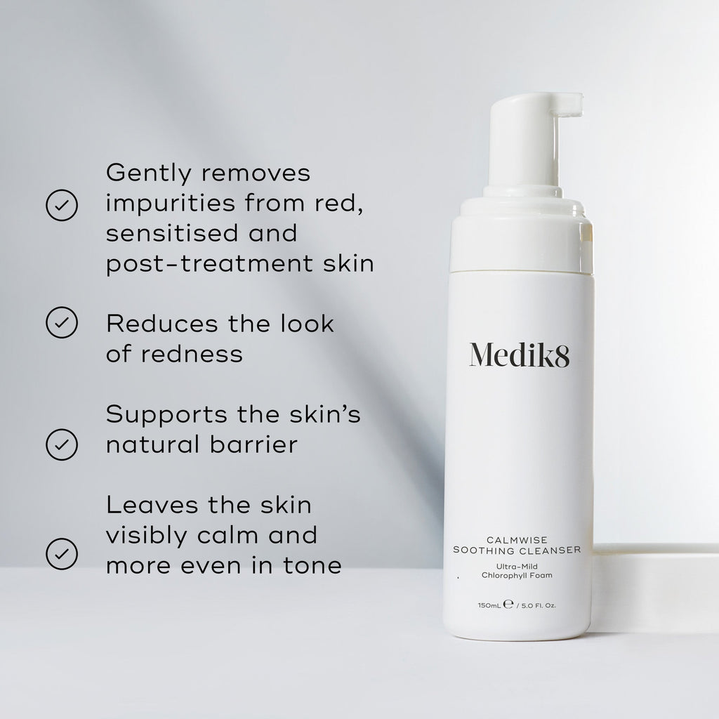 The white bottle of Calmwise™ Soothing Cleanser by Medik8 highlights its benefits for sensitive, red, and compromised skin: it removes impurities, reduces redness with a chlorophyll-infused formula, supports the barrier, and evens skin tone.