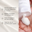 A person dispenses Cream Cleanse™ by Medik8 onto their hand. The text highlights its benefits: removing impurities, nourishing skin with a moisturizing cleanse, supporting the barrier, and being ideal for dry or sensitive skin.