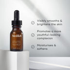A bottle of Medik8 Intelligent Retinol™ rests on a white surface, promising age-defying benefits: smoother, brighter skin; enhanced youthfulness; and increased moisture and softness.