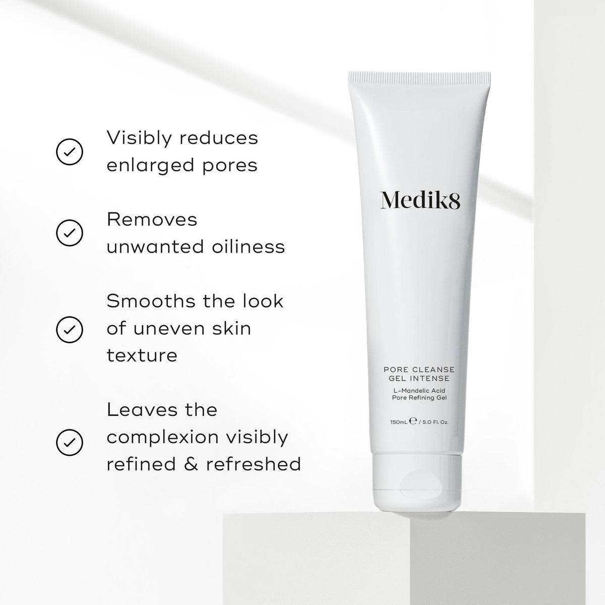 A white tube of Medik8 Pore Cleanse Gel™ Intense rests on a light surface, showcasing its benefits: this exfoliating gel cleanser with AHA/BHA complex minimizes pores, reduces oiliness, smooths skin texture, and refines complexion for radiant skin.