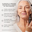An older woman uses Medik8's Super C Ferulic™ serum for sun aging, benefiting from reduced dark spots, improved fine lines, increased firmness, and evened skin tone for radiant, youthful-looking skin.