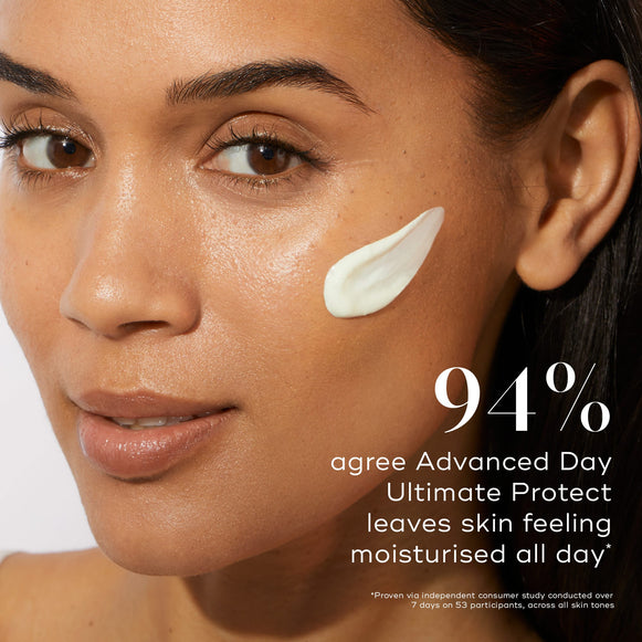 Close-up of a person applying a product on their cheek. A study claims 94% agree that Medik8's Advanced Day Ultimate Protect™, with DNA repair enzyme technology, keeps skin moisturized all day.