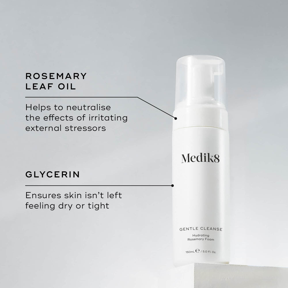 The white bottle of Medik8's Gentle Cleanse™ is a rosemary-infused hydrating foam ideal for sensitive skin, featuring a pH-balanced formula with rosemary leaf oil and glycerin.