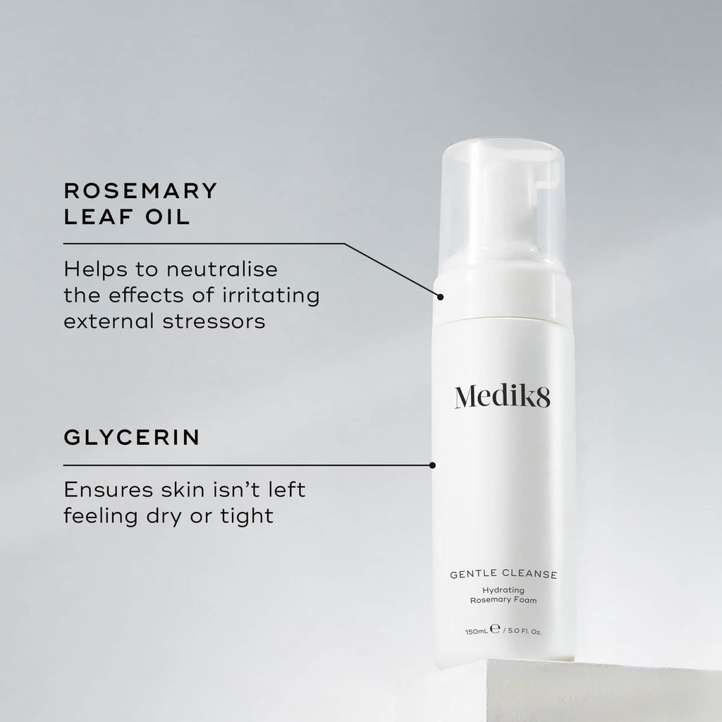 The white bottle of Medik8's Gentle Cleanse™ is a rosemary-infused hydrating foam ideal for sensitive skin, featuring a pH-balanced formula with rosemary leaf oil and glycerin.