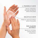 Hands applying Medik8's Pore Cleanse Gel™ Intense, an exfoliating gel cleanser with L-mandelic acid, salicylic acid, and red clover extract. This AHA/BHA complex deeply exfoliates while minimizing sebum production for a clearer complexion.