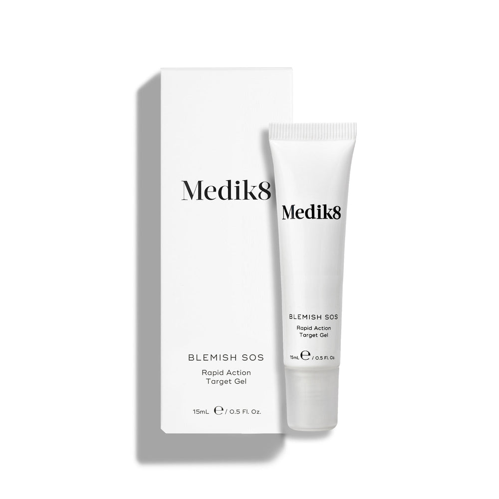 Medik8's Blemish SOS™ is a powerful blemish treatment featuring salicylic acid, shown in its 15ml tube next to its box on a white background.