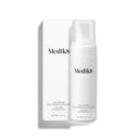 The white bottle of Calmwise™ Soothing Cleanser by Medik8, infused with chlorophyll to soothe compromised skin, comes with a pump dispenser and a matching box. Both feature the brand and product name elegantly in black text.