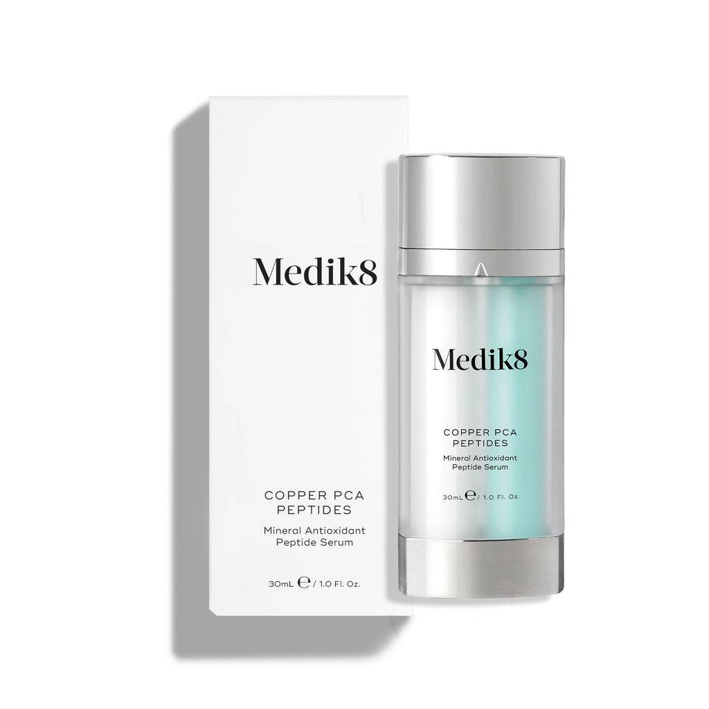 The Medik8 Copper PCA Peptides™ serum bottle, displayed next to its box, contains 30 ml of a rejuvenating peptide and mineral antioxidant blend.