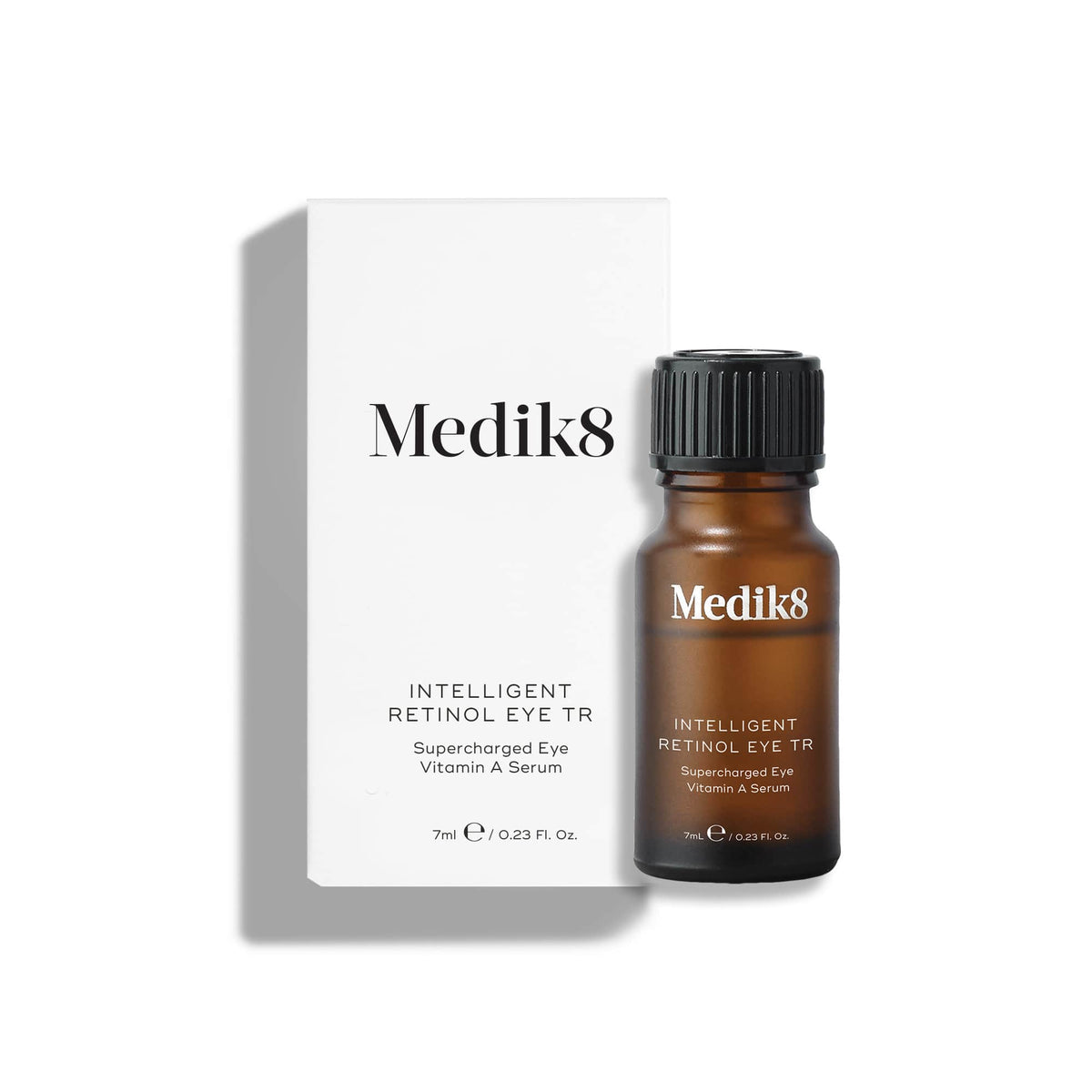 The Medik8 Intelligent Retinol Eye TR™ serum in a brown bottle, enhanced with climbazole, is elegantly displayed next to its white packaging box.