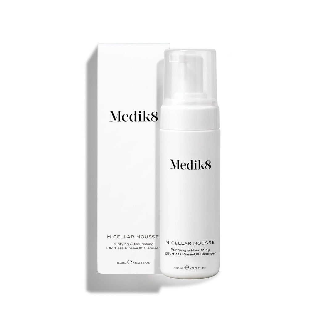A Medik8 Micellar Mousse™ cleanser, featuring micellar cleansing technology for efficient makeup removal, is placed in front of its white box, both clearly labeled with product details.