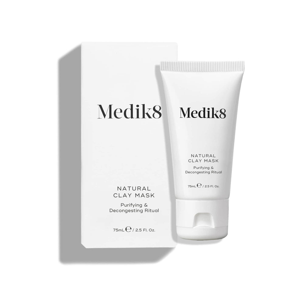 The Natural Clay Mask™ by Medik8, in a 75mL / 2.5 Fl. Oz tube with its sleek white box labeled "Purifying & Decongesting Ritual," uses bentonite and kaolin clay to refine pores.