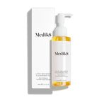 A Medik8 Lipid-Balance Cleansing Oil™ bottle with a pump top is showcased alongside its box against a plain background, featuring anti-pollution technology for effective makeup removal.
