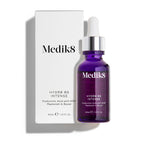 A purple dropper bottle, labeled "Hydr8 B5™ Intense" by Medik8, stands next to its white box, describing the hyaluronic acid serum as packed with NMF for skin rehydration and a boost, along with superfood antioxidants benefits.
