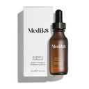 A 30ml bottle of Medik8's Super C Ferulic™ sits elegantly beside its white box, promising skin-brightening benefits and protection against sun aging.