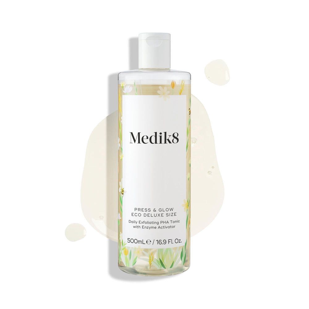 A 500mL bottle of Medik8 Press & Glow® daily exfoliating PHA tonic, enriched with enzyme activator and polyhydroxy acid, is shown on a white background with light liquid splashes—ideal for achieving glowing skin.