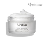 An open jar of Medik8's Total Moisture Daily Facial Cream™ shows its creamy contents for deep hydration. The label endorses AM/PM use and includes prebiotic peptides for microbiome support, with a "dermatologist recommended" badge prominently visible.