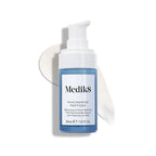 A blue and white pump bottle labeled "Niacinamide Peptides" by Medik8 Cyprus stands before a smear of white serum, showcasing this non-comedogenic, pore-refining skincare product.