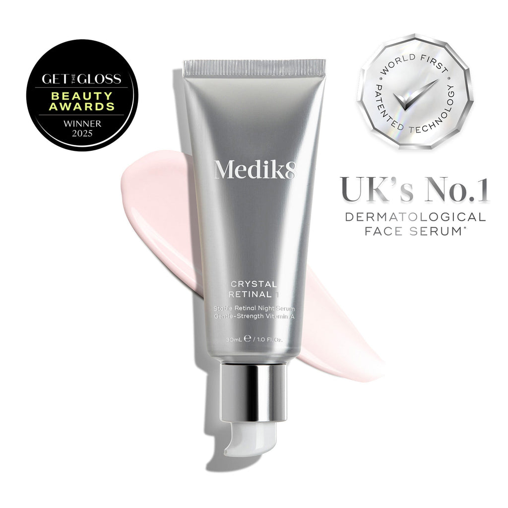 A tube of Medik8 Crystal Retinal® with serum smears, an award badge, and text reading “UK’s No.1 Dermatological Face Serum” and “World First Patented Technology.”.