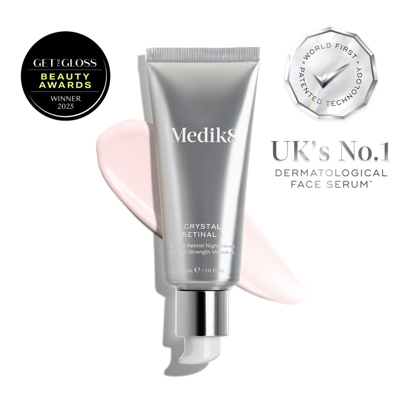 A tube of Medik8 Crystal Retinal® with serum smears, an award badge, and text reading “UK’s No.1 Dermatological Face Serum” and “World First Patented Technology.”.