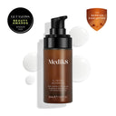 A bottle of Medik8 Cyprus C-Tetra® Advanced vitamin C serum with pump, product drops, an award badge, and a "0% Barrier Disruption" badge on a white background for skin brightening and anti-ageing.