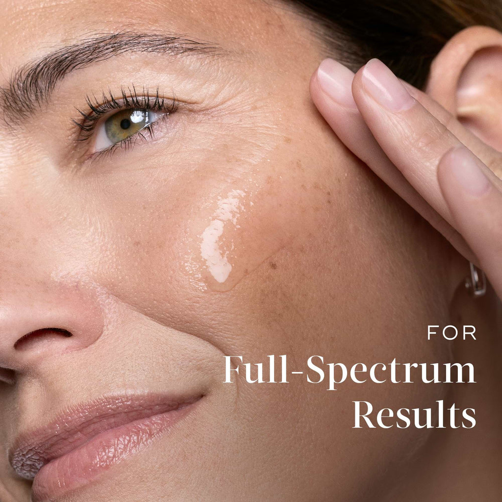 A close-up of a woman's face with Medik8 Cyprus Exo-PDRN Prismatic+ applied to her cheek, accompanied by the text "For Full-Spectrum Results.