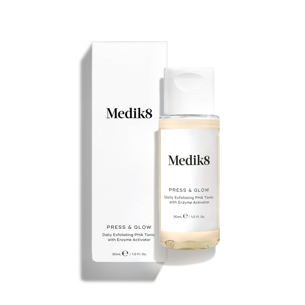 A 30 ml bottle of Medik8's Press & Glow™ (Travel Size) for sensitive skin sits next to its white packaging, offering a gentle yet effective exfoliating acid toner ideal for your skincare routine.