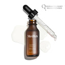 A brown bottle labeled "Medik8 Super C Ferulic™" with a dropper cap, lies on a white surface amidst spilled liquid. Text reads: "Dermatologist Recommended." Ideal for protecting against sun-induced aging and achieving skin-brightening results with its vitamin C serum.