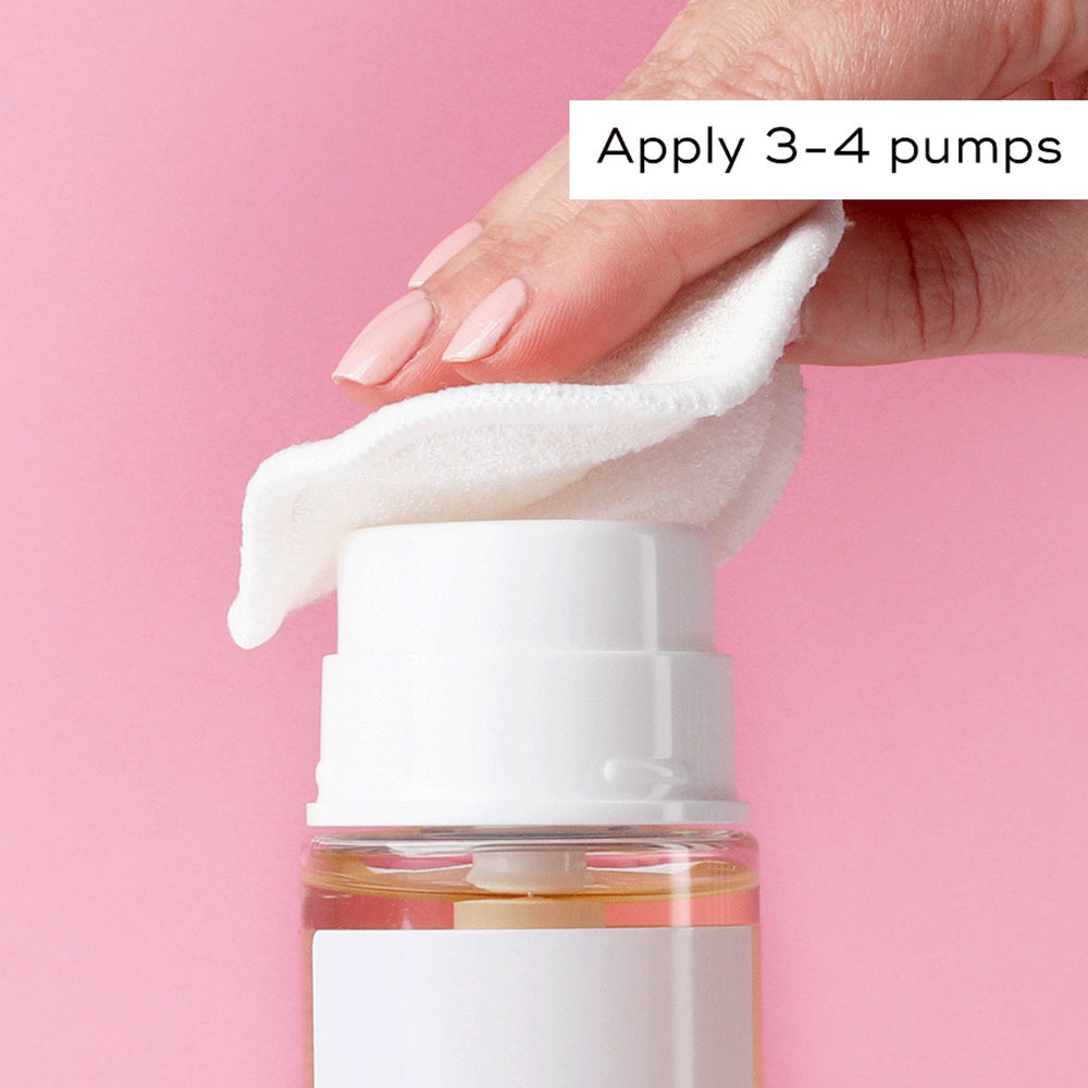 A hand holds a cotton pad over the Press & Glow Refill™ pump bottle by Medik8, dispensing liquid onto it. Text reads: "Apply 3-4 pumps." This acid toner, ideal for sensitive skin, enhances radiance with exfoliating poly hydroxy acids. The background is pink.