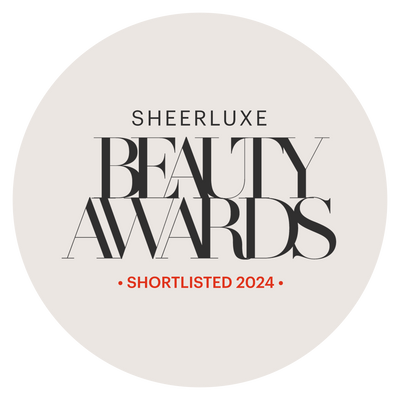 The bold text states "Sheerluxe Beauty Awards," with "Shortlisted 2024" in red. On a light gray background, the Medik8 Press & Glow™ (Travel Size) is highlighted among products ideal for sensitive skin, featuring exfoliating poly hydroxy acids for a gentle glow.
