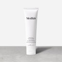 The Medik8 Physical Sunscreen™ in a 60ml white tube offers SPF50 with UVA/UVB protection and anti-pollution benefits, standing sleekly on a gray surface against a light gray background.